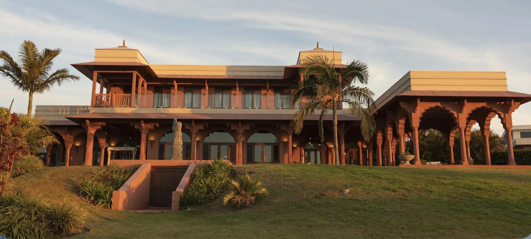 The Main Residence, the exterior at golden hour viewed from the lower lawn