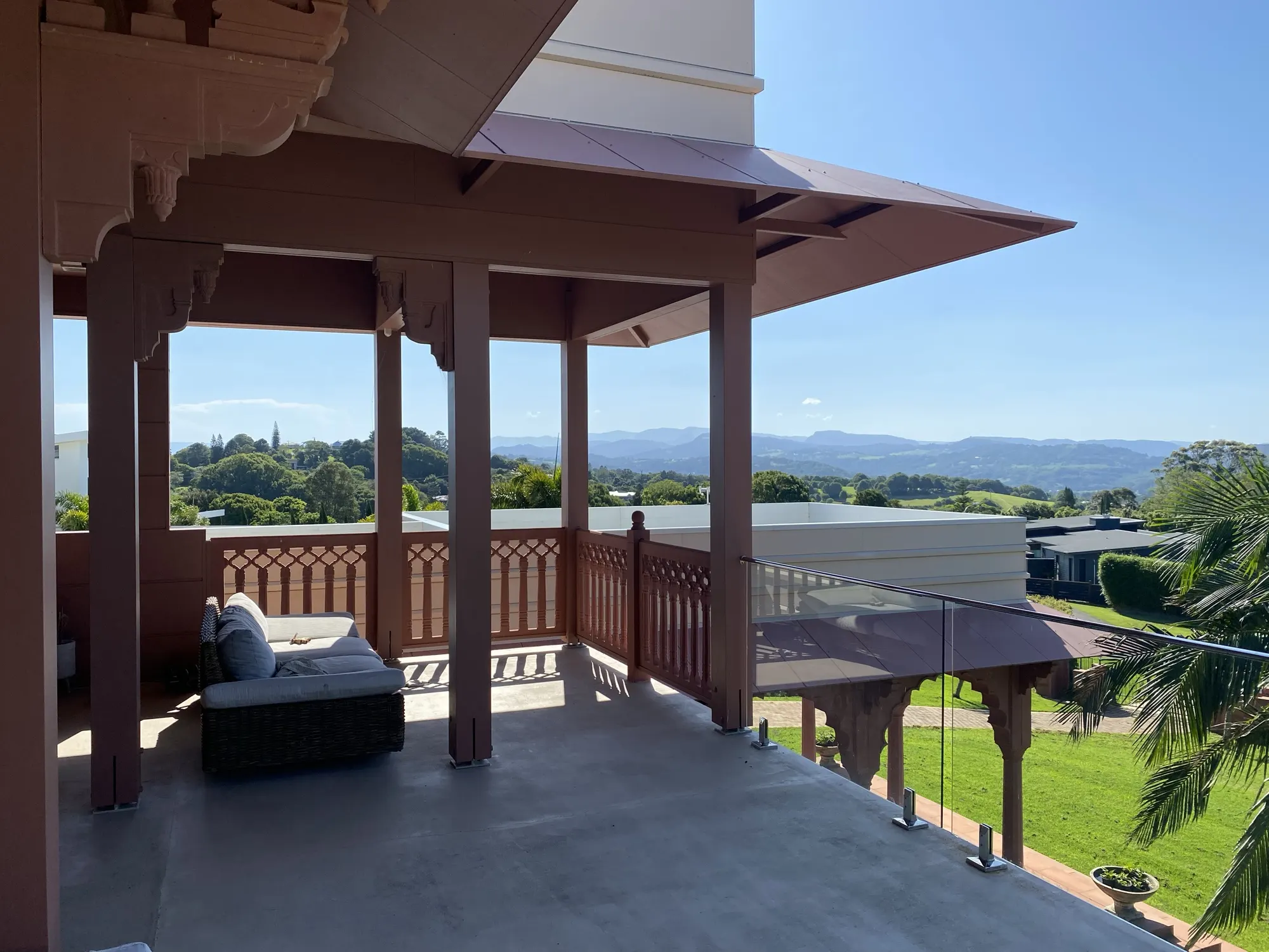 The Main Residence, the upper balcony with carved timber balustrade overlooking the hinterland