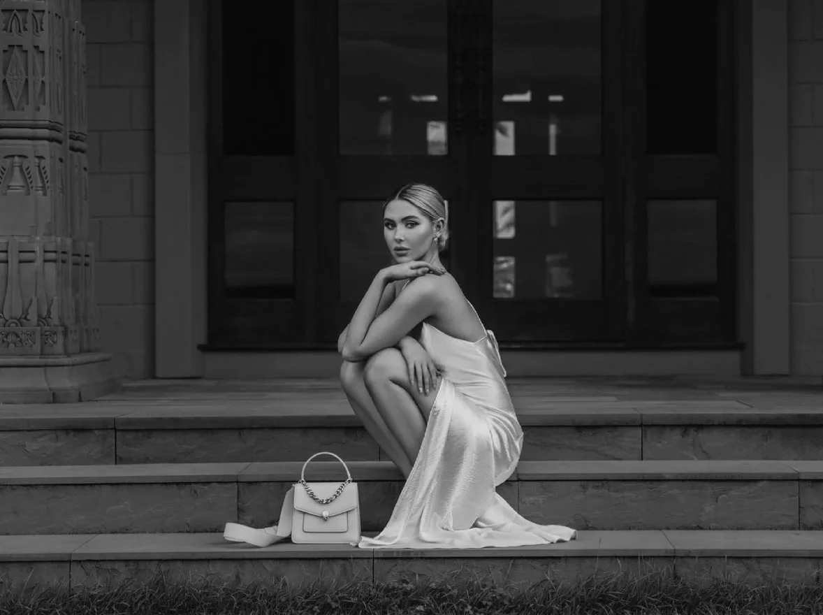 A black and white commercial campaign shot on the residence steps